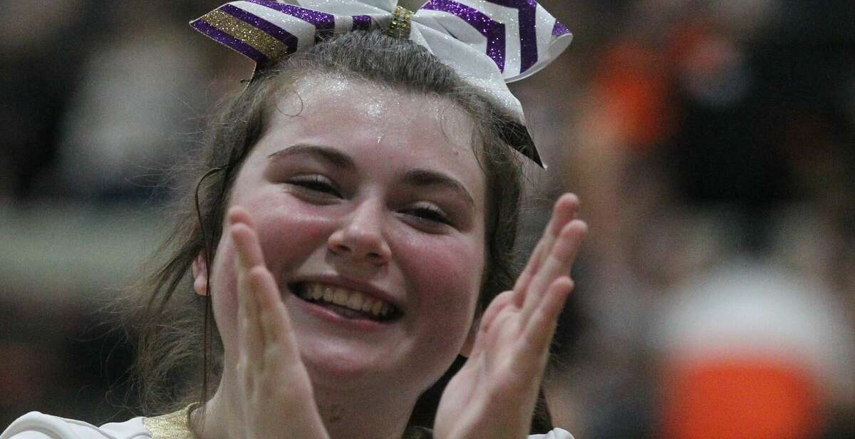 A Routt cheerleader cheers during Tuesday night's game at the Waverly Holiday Tournament