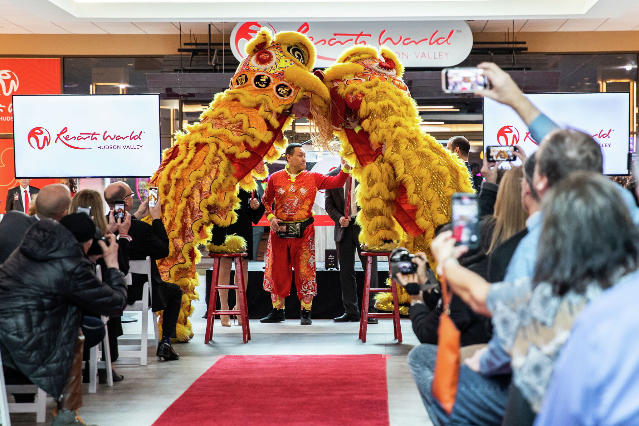 Entertainers perform lion dance during the opening ceremony of the