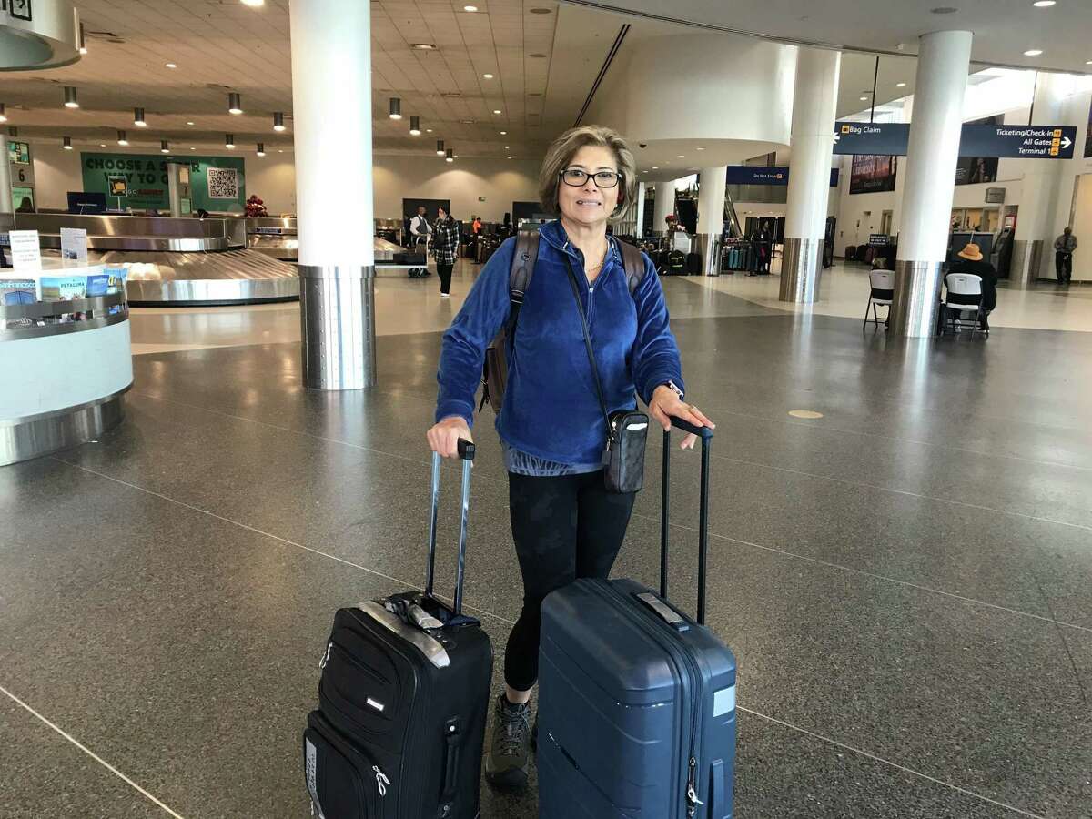 Ingrid Perez endured three canceled flights, including an overnight stranded in the Las Vegas airport. She arrived at Oakland International Airport on Wednesday.