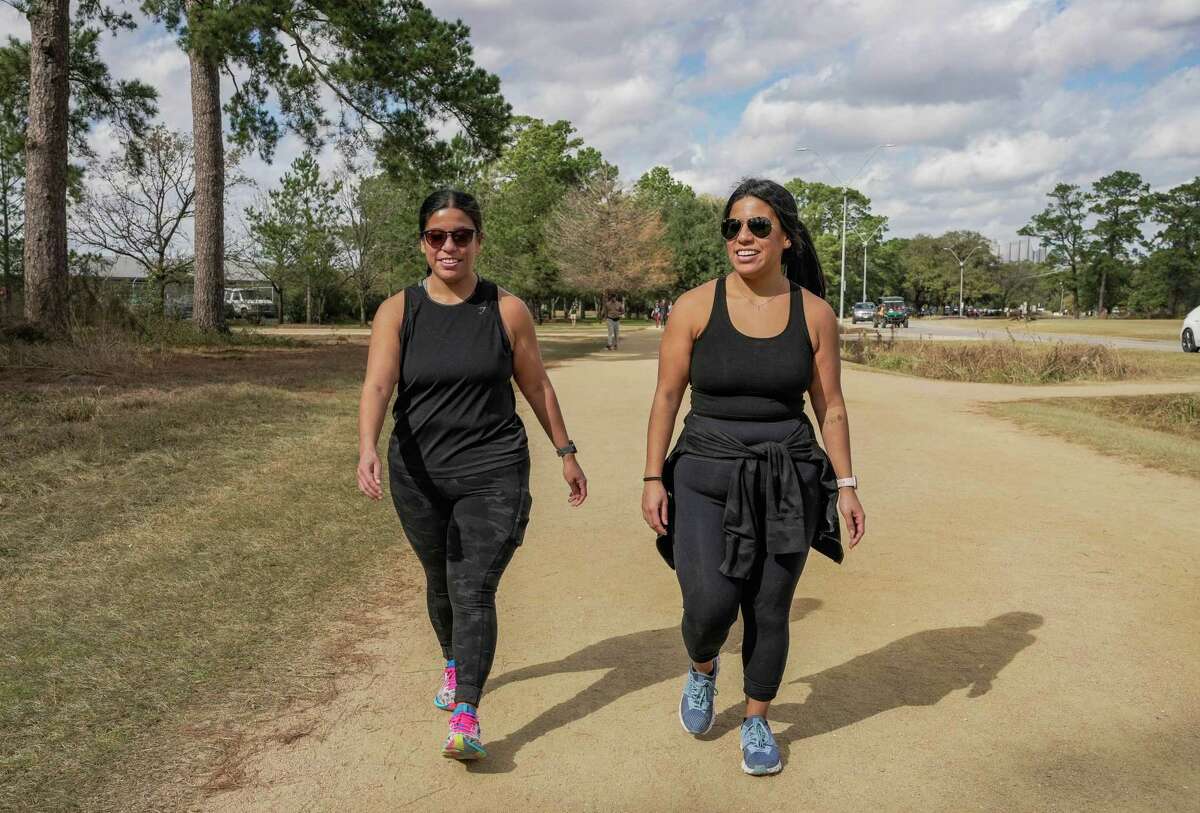 Twins Liah Martinez and Lauryn Chavez, 26, walk together as they pursue fitness journeys after having had gastric sleeve surgery about four years ago on Wednesday, Dec. 28, 2022 in Houston.