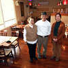 From left, wife and husband co-owners Mei Lin Chang Wu and Shan Yu Chang pose with their granddaughter, Fiona Liu, in the dining room at Formosa Asian Fusion Restaurant, in North Haven, Conn. Dec. 28, 2022.
