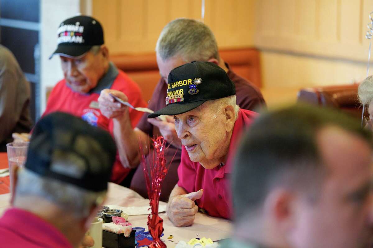 Pearl Harbor survivor Kenneth Platt talks with friends and marks his 101st birthday with a breakfast celebration Wednesday morning at Jim's Restaurant on Hillcrest.