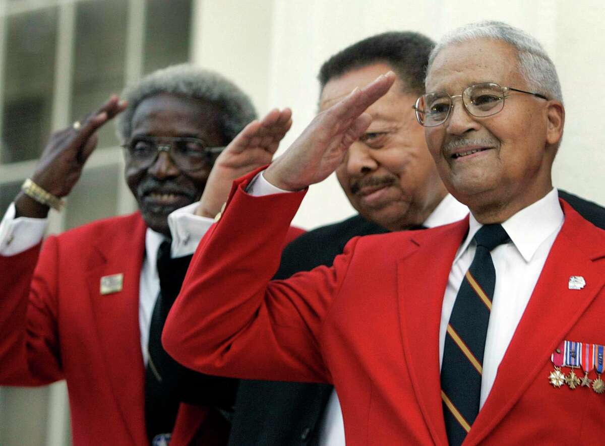 From left, veterans Cicero Satterfield, Lucius Theus and Charles McGee salute for a group photo on the steps of the U.S. Capitol to kick off a nationwide fundraising drive for a memorial to the Tuskegee Airmen in 2006.