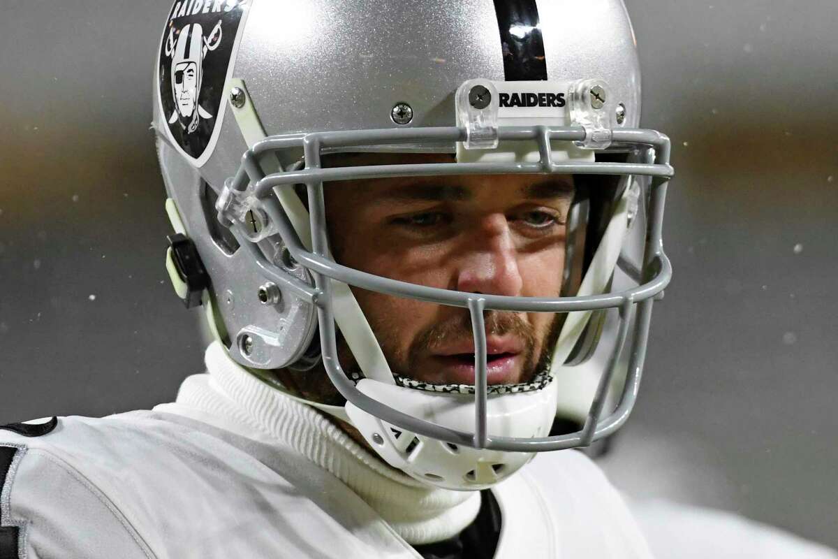 Las Vegas Raiders quarterback Derek Carr (4) warms up before an NFL football game against the Pittsburgh Steelers in Pittsburgh, Saturday, Dec. 24, 2022. (AP Photo/Fred Vuich)