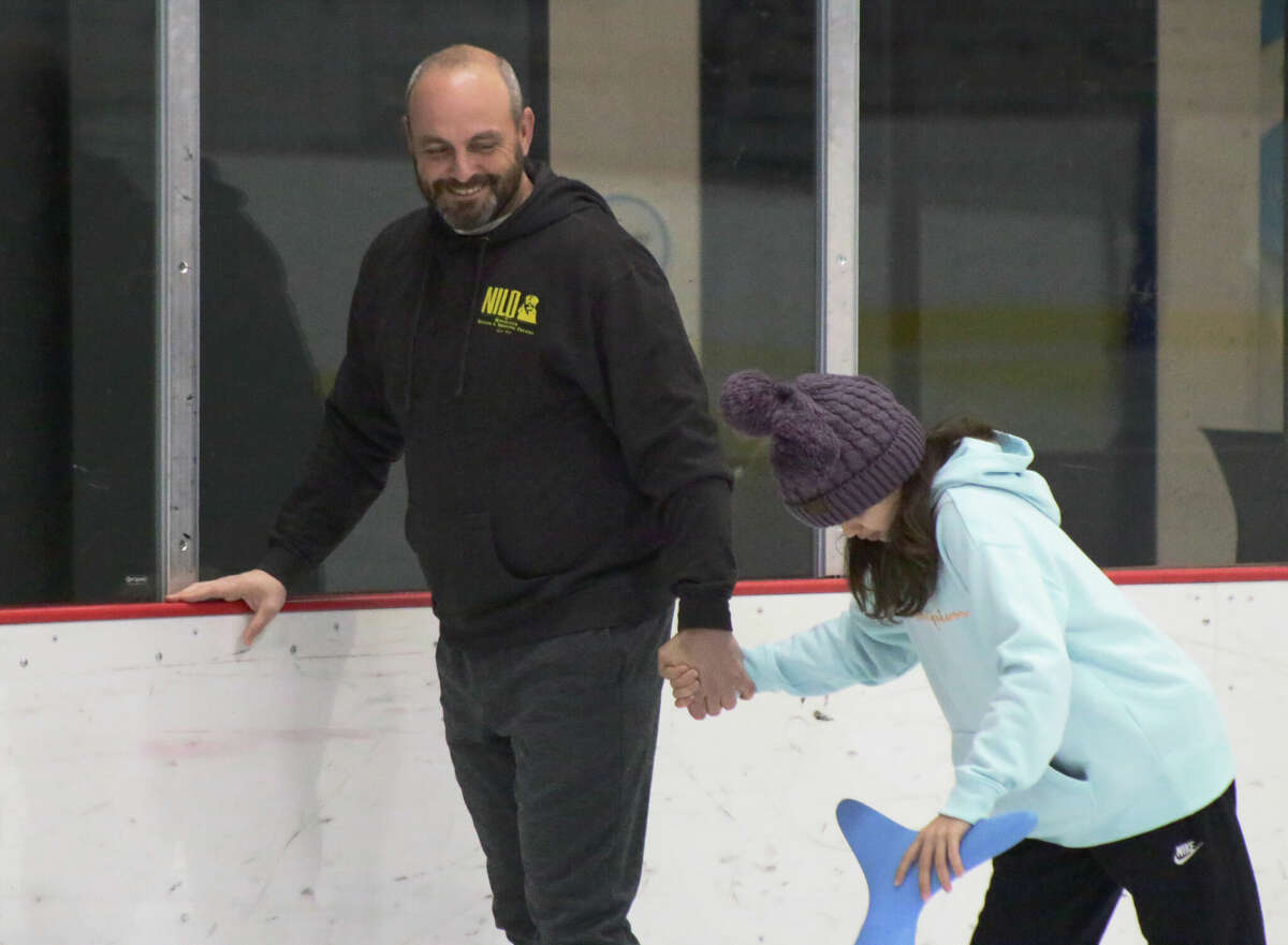 Eric Williams and Sophee Williams skate together at the RP Lumber Center in Edwardsville.