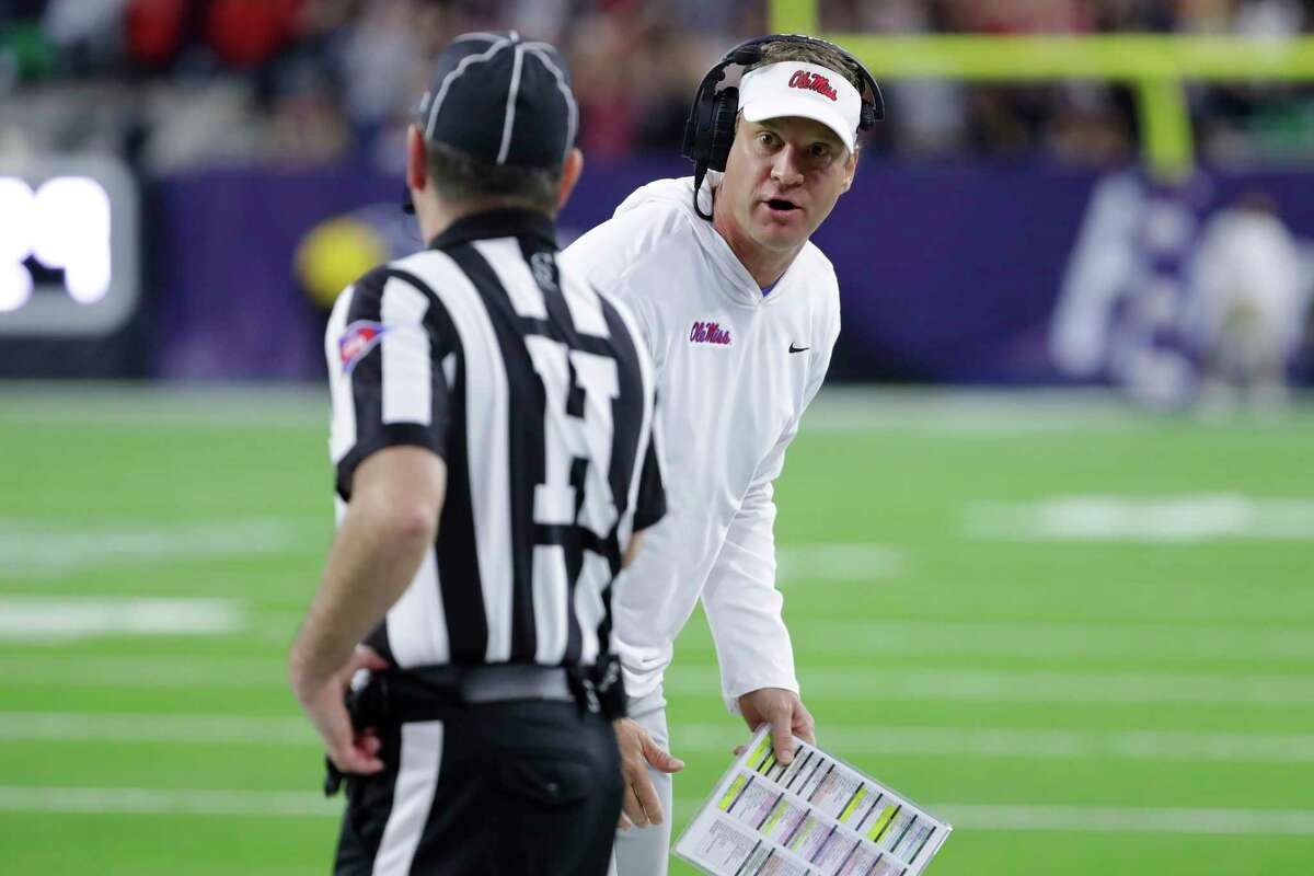 Mississippi coach Lane Kiffin talks with an official about a penalty call during the first half of the team's Texas Bowl NCAA college football game against Texas Tech on Wednesday, Dec. 28, 2022, in Houston.