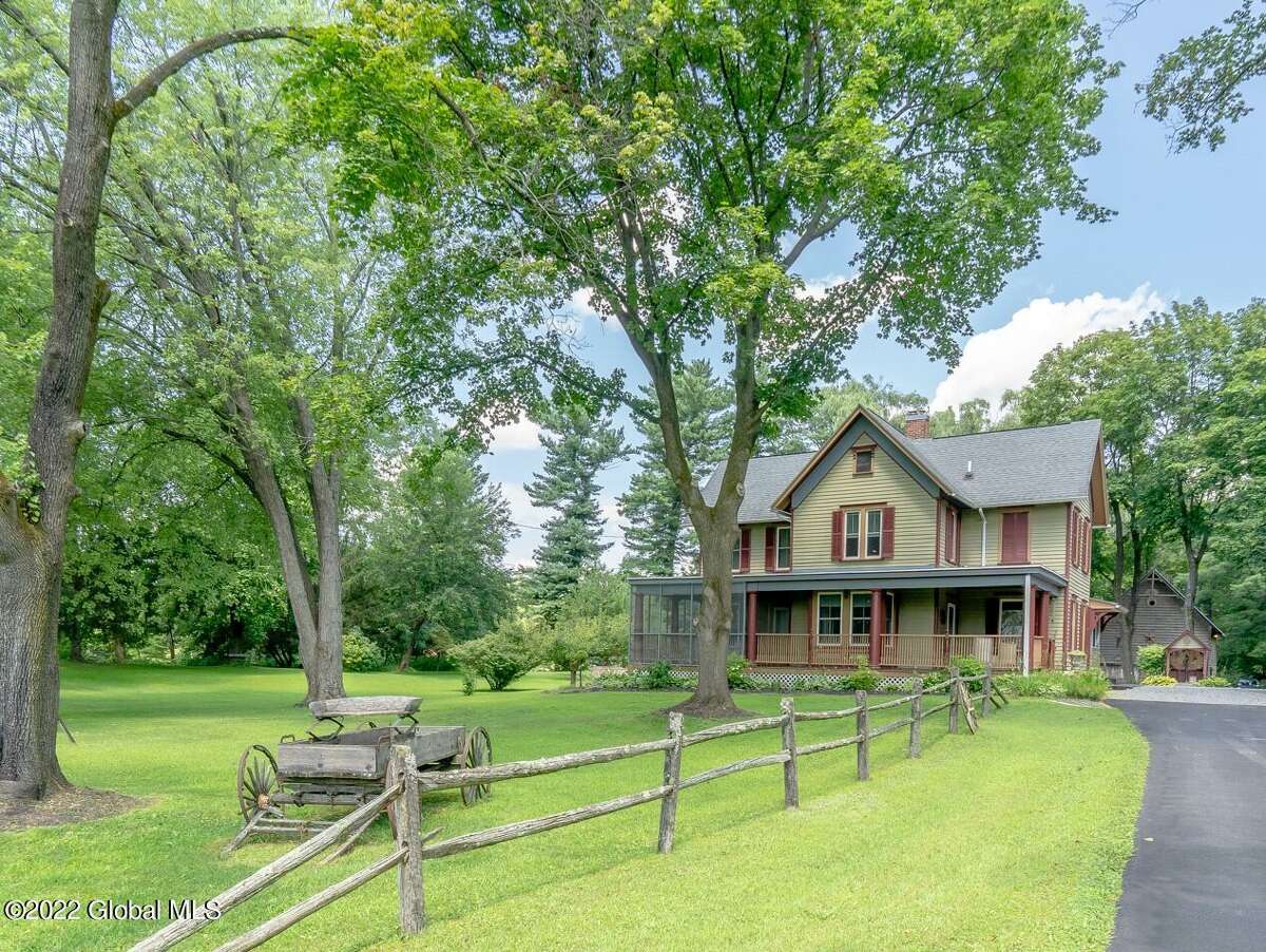 This Victorian-style home contains three bedrooms, two bathrooms and a lot of charm. Country-mouse touches are seen throughout, from the small shed that houses the hand-operated water pump and the wood-post fence leading to the house, to the texture on the fireplace in the dining room. There are also features that you won’t see on every listing, including a summer kitchen and a barn on the 1.6 acre property. Gardens and other landscaping surround a koi pond and in-ground swimming pool in the backyard. Oil heat, Ravena-Coeymans-Selkirk schools. Taxes: $5,499.40. Listing price: $449,000. For more information, contact listing agent Janet Shaye, Howard Hanna, janetshaye@howardhanna.com.