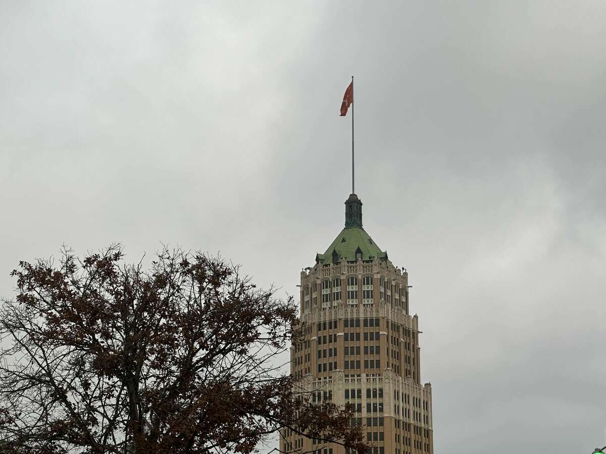 The Texas Longhorns flag is seen flying on the Tower Life Building in downtown San Antonio.
