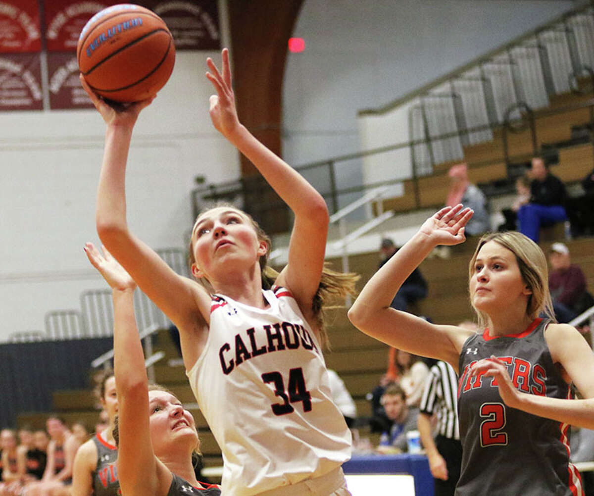 Calhoun's Kate Zipprich (34) goes up for two of her game-high 22 points against South County on Wednesday at the Carlinville Holiday Tournament.