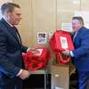 Deputy Albany County Executive Dan Lynch, left, and County Executive Dan McCoy stack reusable bags on Wednesday, Dec. 14, 2022, near the entrance to the county building on State Street in Albany, NY.