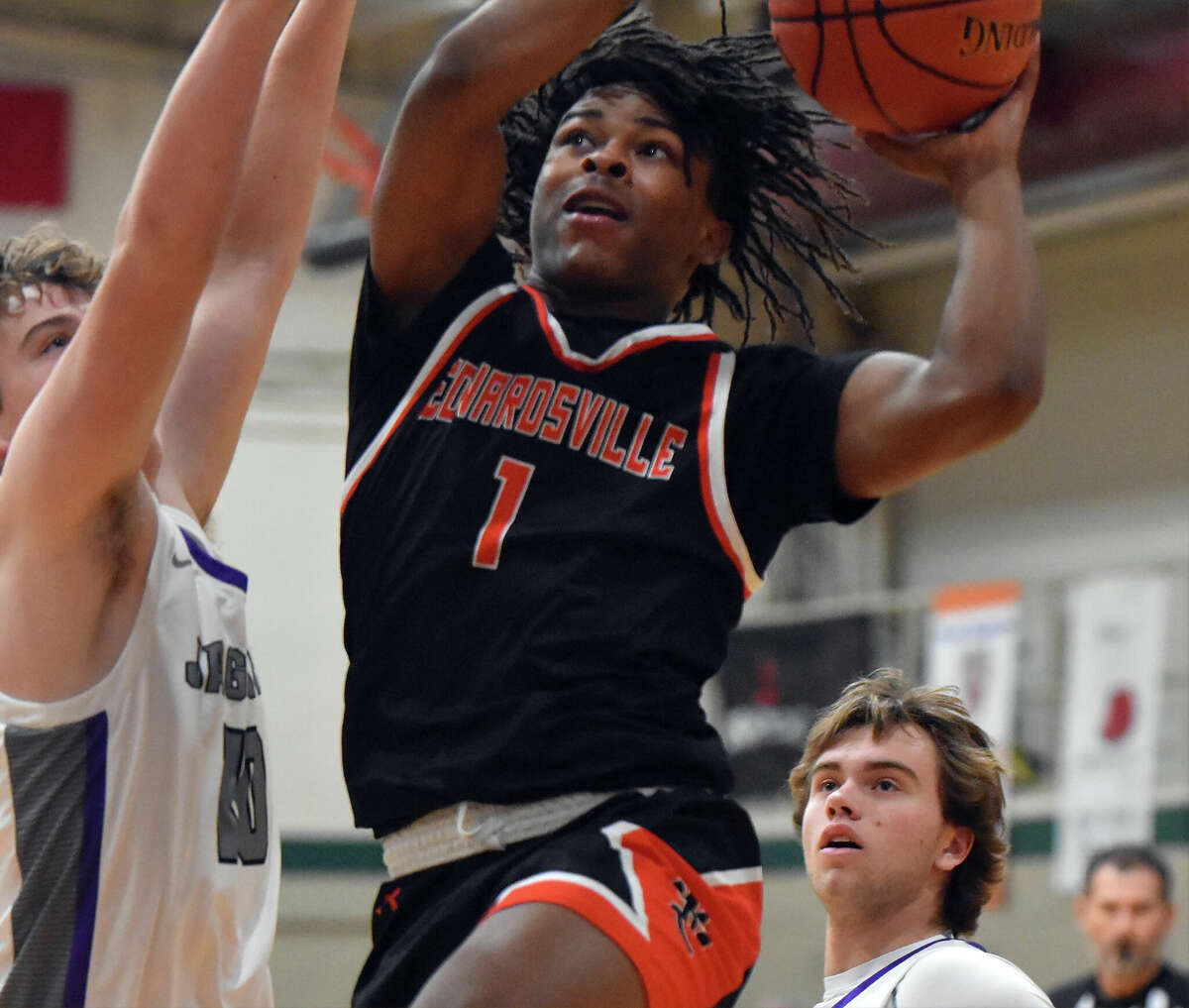 Edwardsville's AJ Tillman scores despite contact against Fort Zumwalt West in the first half of a game on Thursday in the Don Mauer Invitational at MICDS in St. Louis.