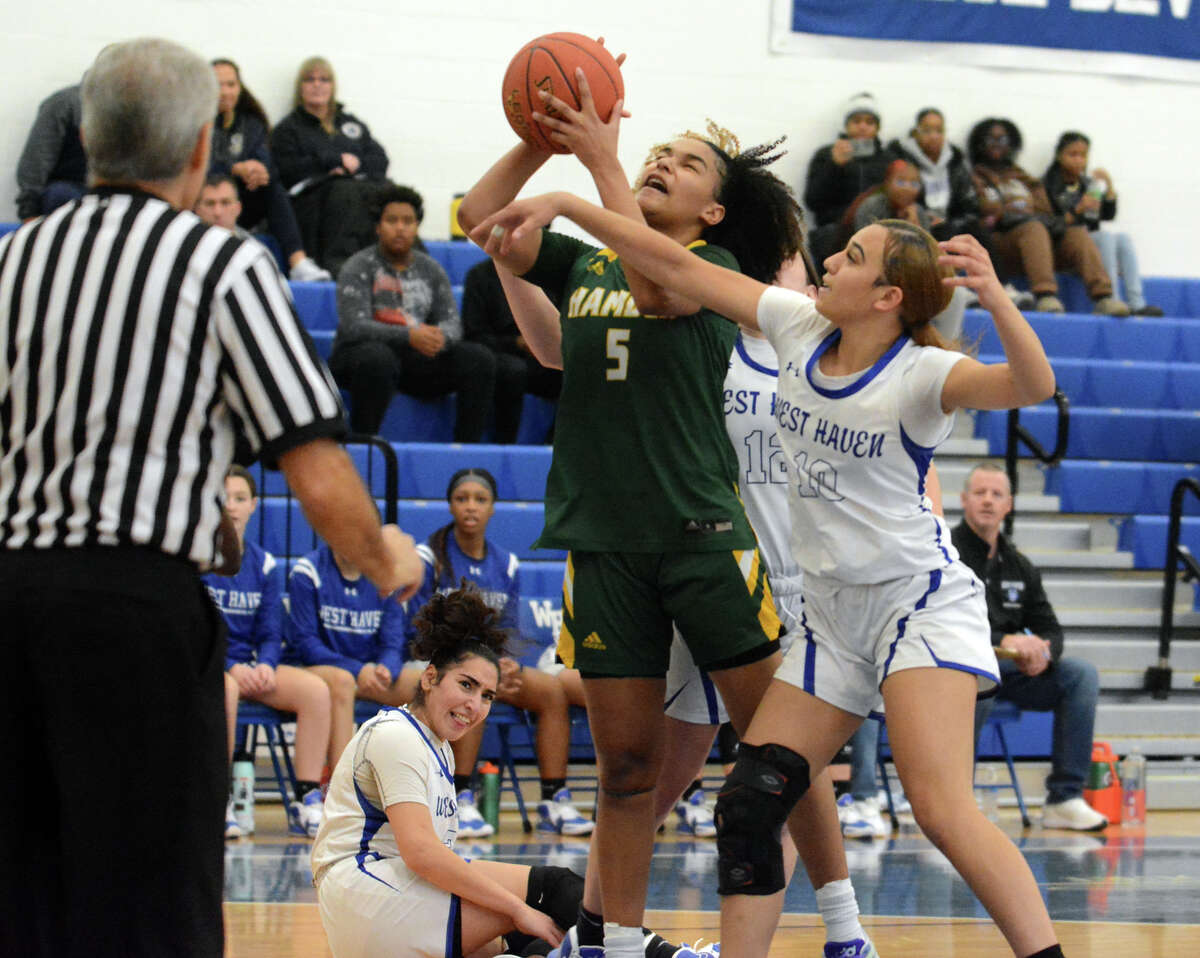 Mya Fleming of West Haven fouls Alana Philpotts of Hamden during first half action.