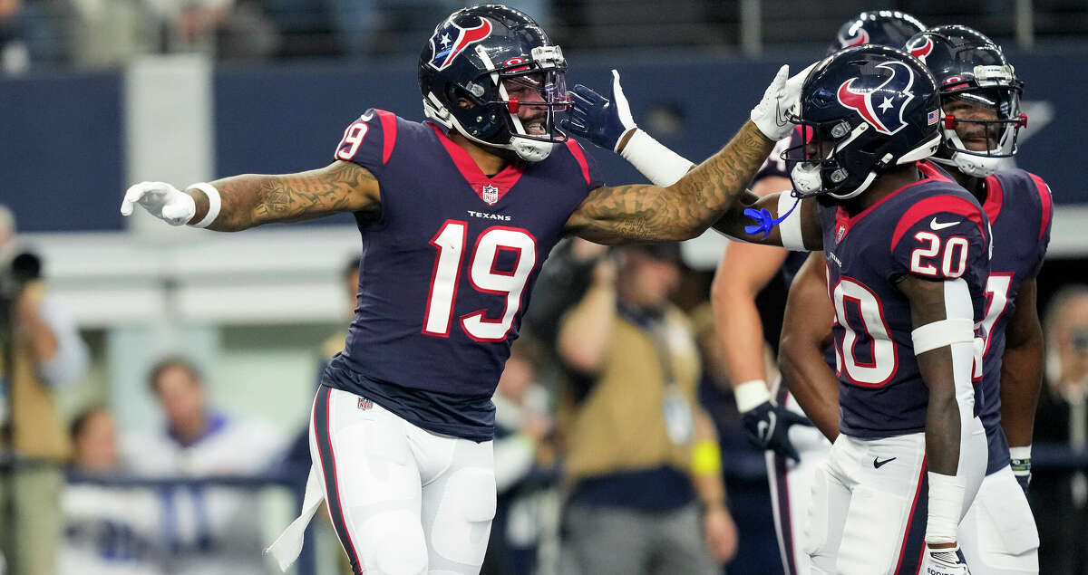 Houston Texans wide receiver Amari Rodgers (19) celebrates his 28-yard touchdown reception against the Dallas Cowboys during the first half of an NFL football game Sunday, Dec. 11, 2022, in Arlington.
