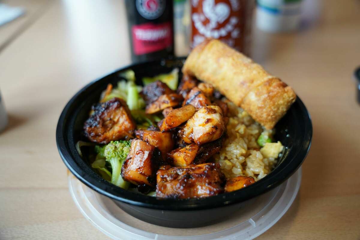 Teriyaki Madness' spicy chicken bowl with an egg roll, broccoli and brown rice.