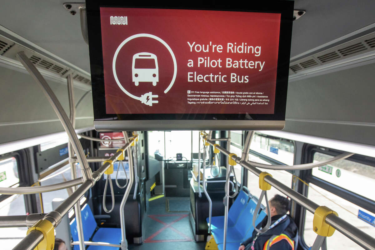 A sign lets riders know they are on a Pilot Battery Electric Bus in San Francisco on Dec. 15, 2022.