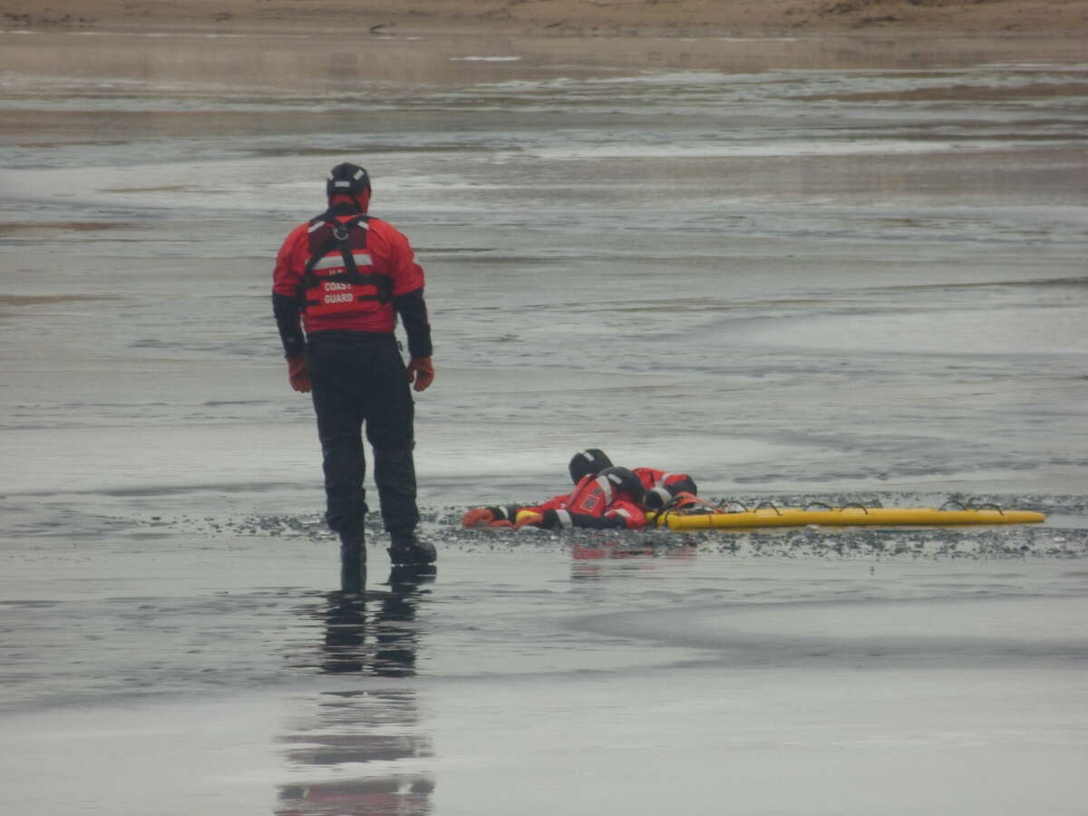 Members of the U.S. Coast Guard Manistee Station train for ice rescue situations at Man Made Lake on Dec. 30.