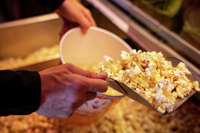 This Viral Video Shows How To Evenly Butter Your Movie Theater Popcorn