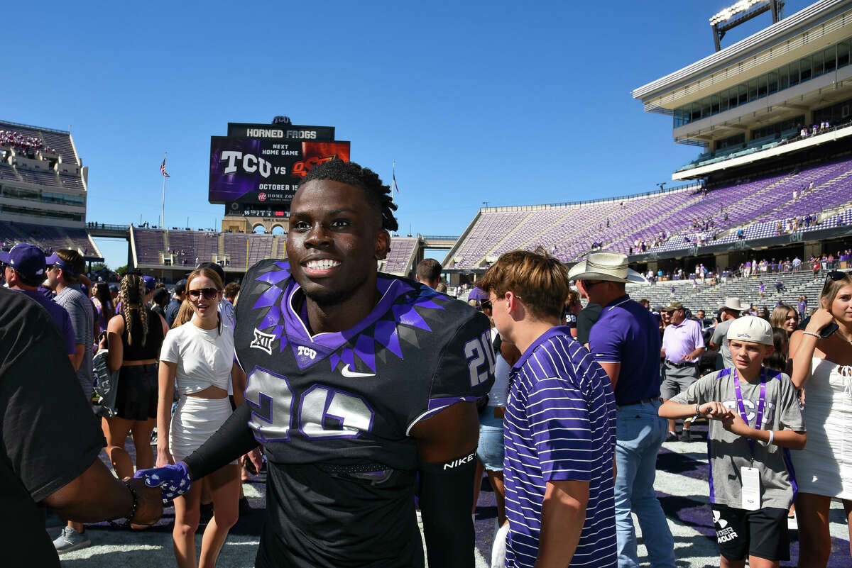 TCU Horned Frogs wide receiver Christopher Chosen smiles as he leaves the field after TCU's home win over Oklahoma at Amon G. Carter Stadium in Fort Worth on October 1, 2022.  TCU won the game with a 55-24 final.