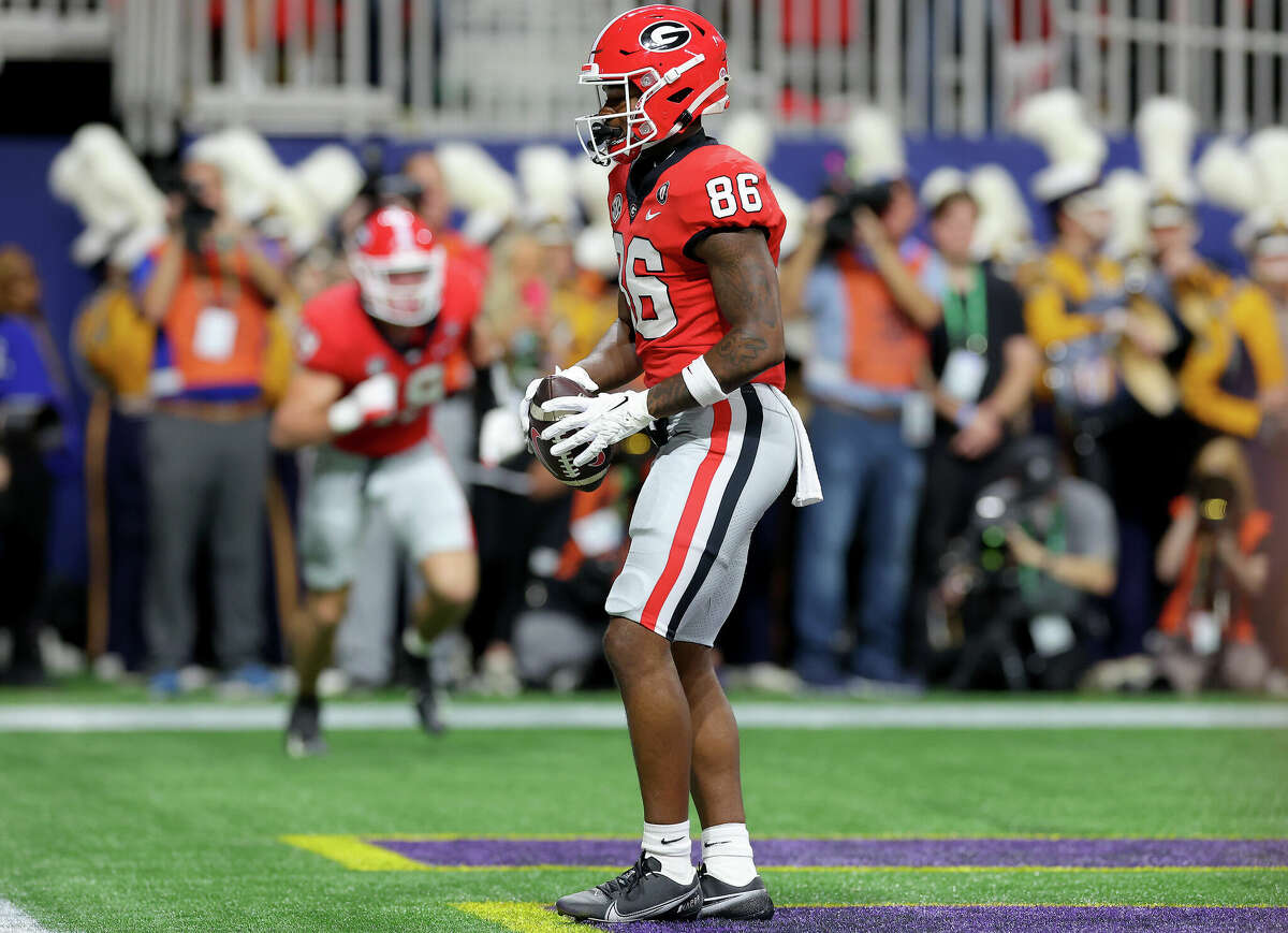 Dillon Bell of the Georgia Bulldogs celebrates after scoring against the LSU Tigers in the second quarter of the SEC Championship game on December 3, 2022, at the Mercedes-Benz Stadium in Atlanta, Georgia.