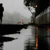 A runner makes their way down the Mill Valley-Sausalito Path past large puddles during a brief respite from the atmospheric river weather in Mill Valley, Calif. Friday, December 30, 2022.