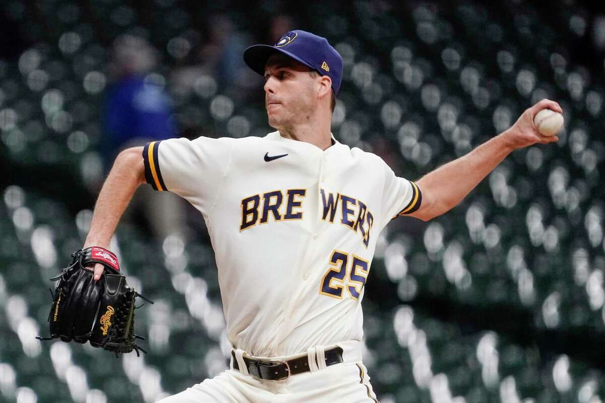 FILE -Milwaukee Brewers' Taylor Rogers throws during the eighth inning of a baseball game against the Arizona Diamondbacks Monday, Oct. 3, 2022, in Milwaukee. Left-hander Taylor Rogers is joining twin brother Tyler as a reliever with the San Francisco Giants, agreeing to a $33 million, three-year contract, Wednesday, Dec. 28, 2022. (AP Photo/Morry Gash, File)