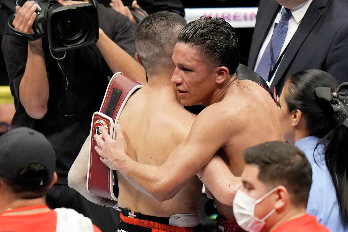 Kazuto Ioka, left, of Japan and Joshua Franco of the U.S. greet each other after their WBO, WBA super flyweight world boxing title unification match in Tokyo, Saturday, Dec. 31, 2022. The fight ended in a draw. (AP Photo/Shuji Kajiyama)