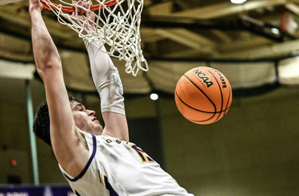 UAlbany forward Jonathan Beagle (15) dunks the ball against New Hampshire during an NCAA basketball game Saturday, Dec. 31, 2022, in Troy, N.Y. The Great Danes lost that game but get another shot at the Wildcats on the road Wednesday.
