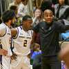 Albany players Sarju Patel (13) a Da'kquan Davis (2) get instructions from head coach Dwayne Killings during an NCAA basketball game against New Hampshire Saturday, Dec. 31, 2022, in Troy, N.Y.