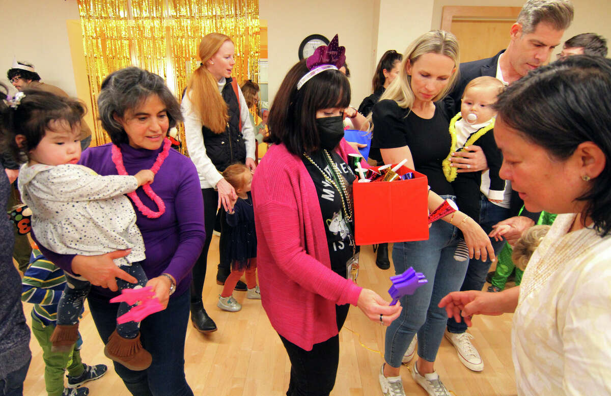 On Saturday, December 31, inside the Marx Family Black Box Theater at the Greenwich Library in Greenwich, Connecticut, children's librarian Deirdre Sullivan brought out party toys for the chance to ring in the new year with a dance party and other fun activities. give out to the children. 2022.