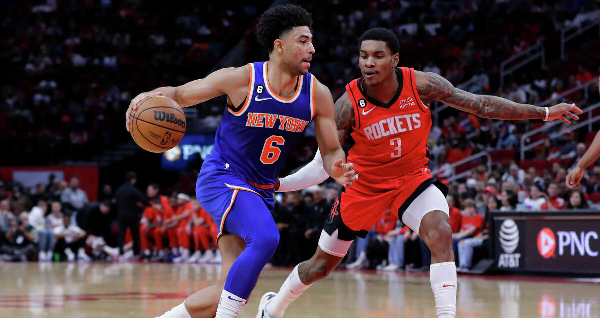 New York Knicks guard Quentin Grimes (6) drives around Houston Rockets guard Kevin Porter Jr. (3) during the first half of an NBA basketball game Saturday, Dec. 31, 2022, in Houston. (AP Photo/Michael Wyke)