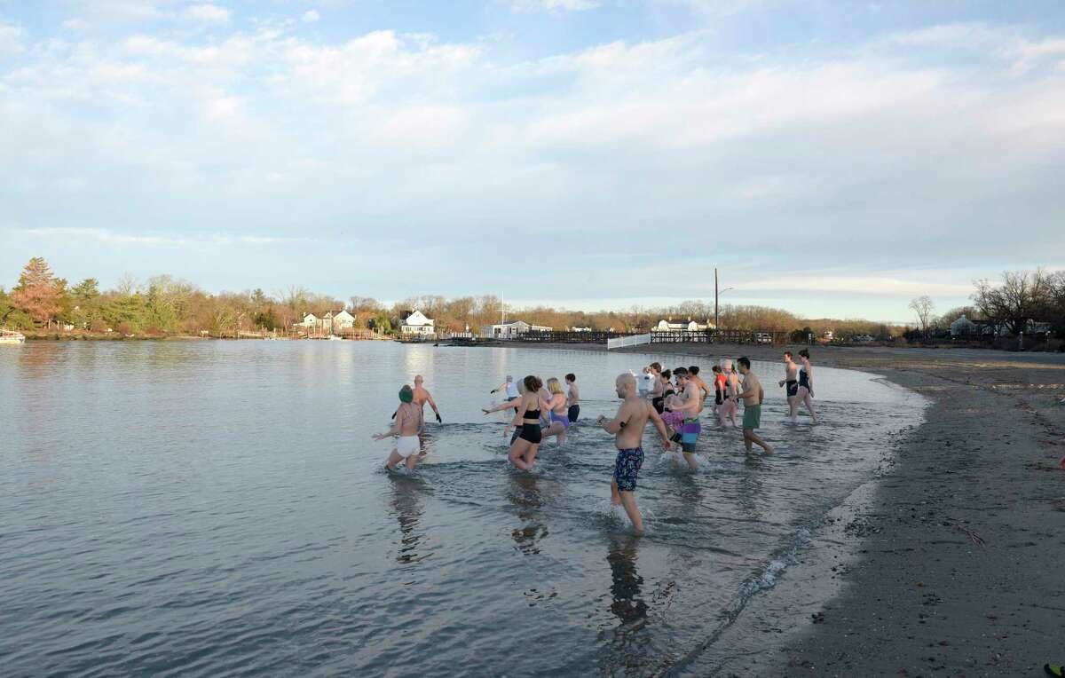 Members of Carozza Fitness joined owner Michael Carozza at Pear Tree Point Beach for a New Years Day polar plunge in Long Island Sound to benefit Animals R Us. Sunday, January 1, 2023, Darien, Conn.