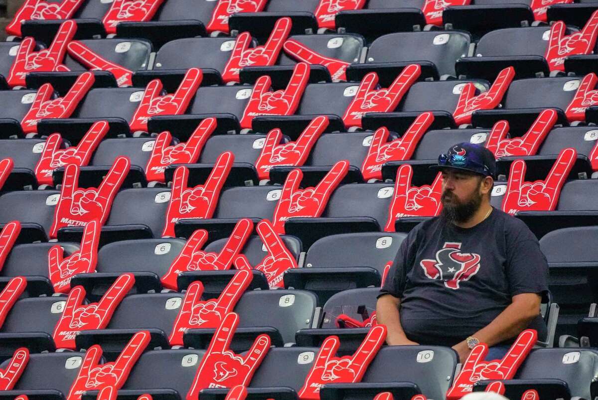 A Houston Texans fan in the stands before the start of an NFL football game at NRG Stadium on Sunday, Jan. 1, 2023 in Houston.
