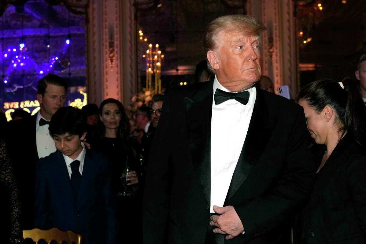Former President Donald Trump arrives for a New Years Eve party at Mar-a-Lago, in Palm Beach, Fla., Saturday, Dec. 31, 2022.