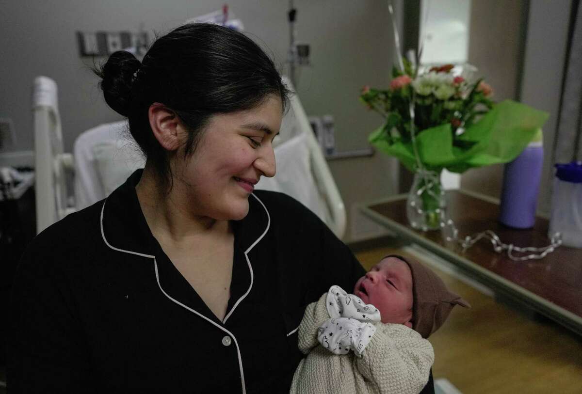 Marielena Cardenas holds her newborn son Sebastian Trapp, one of the first babies born in 2023 in the Houston area on Sunday, Jan. 1, 2023 at St. Luke's Hospital in Sugar Land.