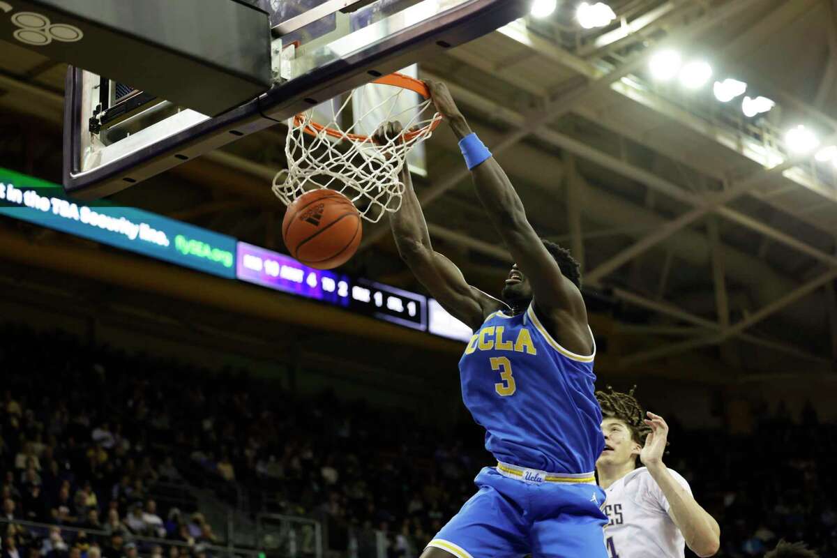 UCLA freshman Adem Bona throws down two of his 18 points in the Bruins’ 74-49 romp at Washington.