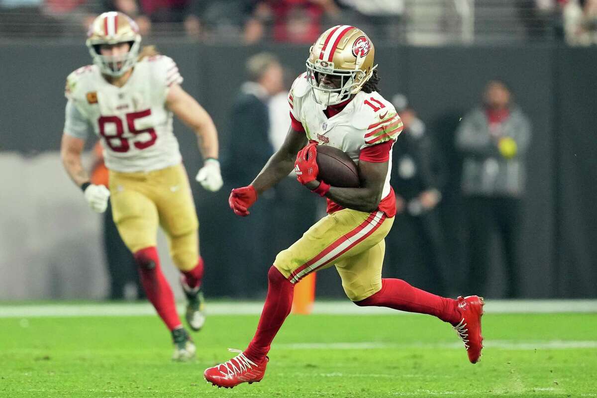 San Francisco 49ers wide receiver Brandon Aiyuk (11) catches a pass during  the first half of an …