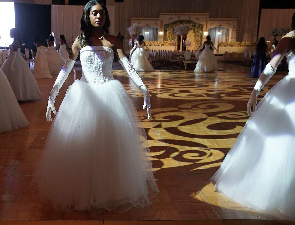 Minla Phillips rehearses a dance with other debutantes participate in the Houston Chapter's 32nd annual Jack & Jill Debutante Ball at Hilton Americas Houston on Thursday, Dec. 29, 2022 in Houston.