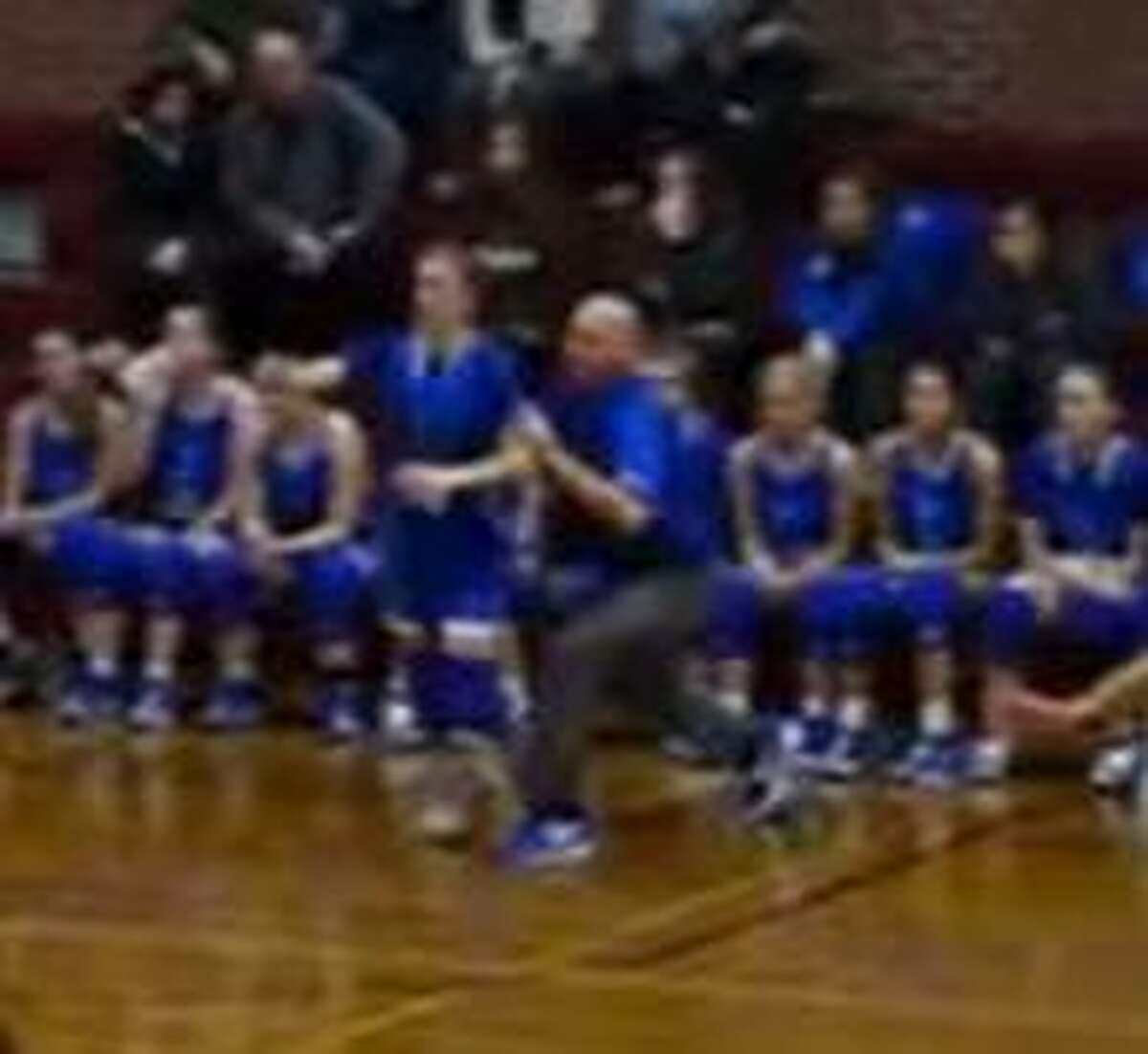 Shaun Russell, the athletic director for East Hampton High School, was placed on leave after he shoved a player during a basketball game last month.