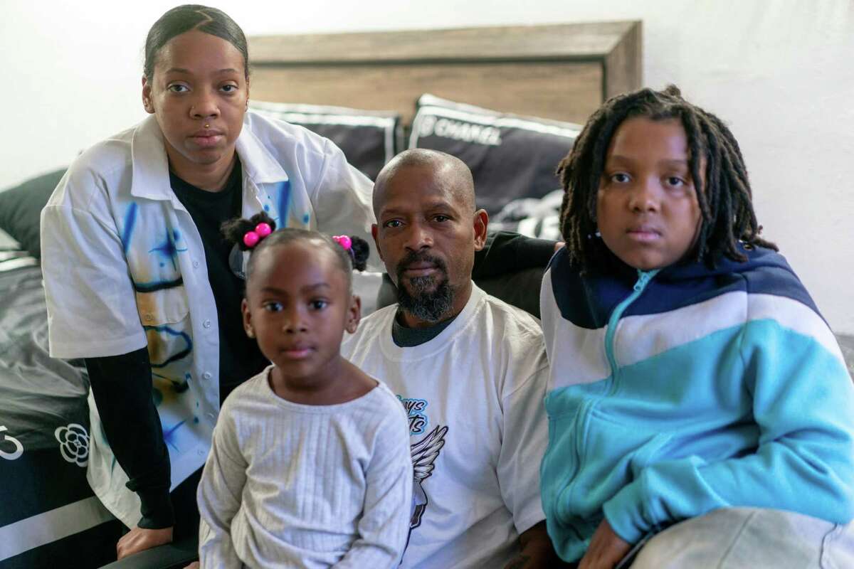 The family of Rob Adams, from left, Raneisha, Ameerah, Robert and Isaiah Adams, at home in Victorville in San Bernardino County.