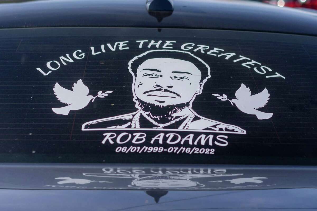 A sticker on the back window of a family vehicle at the residence of Robert Adams, whose son, Rob was shot and killed in confrontation with police.