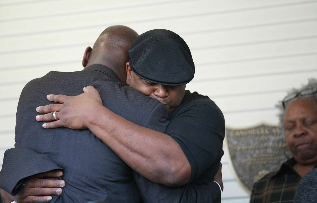 Civil rights attorney Ben Crump, left, comforts Christopher Clark at a press conference in San Marcos, Texas, on Monday Jan. 2, 2023, where they demanded the release of law enforcement body camera video of the fatal shooting of Joshua Wright. Wright was fatally shot by a corrections officer at Ascension Seton Hays Hospital in Kyle, Texas, on Dec 12. (Jay Janner/Austin American-Statesman via AP)