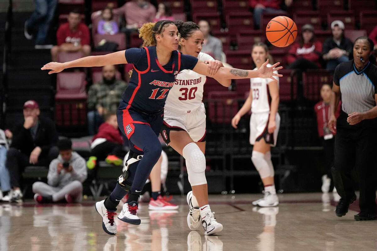 Arizona forward Esmery Martinez steals the ball from Stanford guard Haley Jones during the first half of their Pac-12 game.