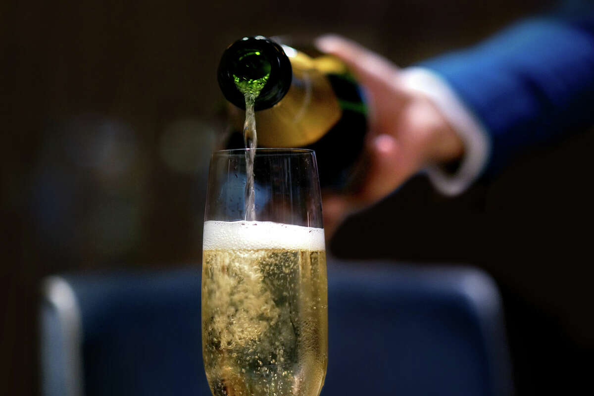 File photo of champagne being poured for New Year's Eve.