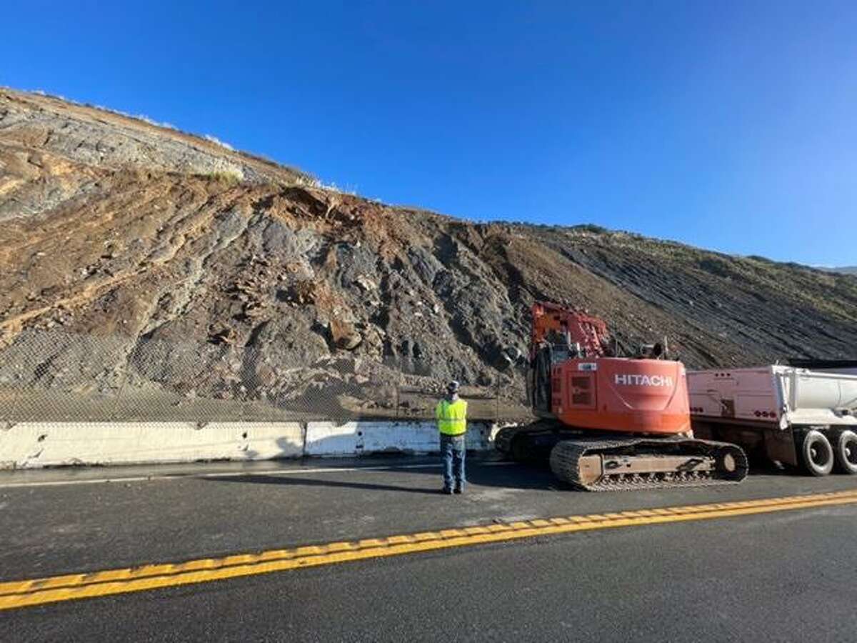 Crews work to clear Highway 1 at Paul’s Slide south of Big Sur on Sunday. The stretch of scenic highway reopened Tuesday from weekend closures but is set to close again Wednesday, Caltrans officials said.