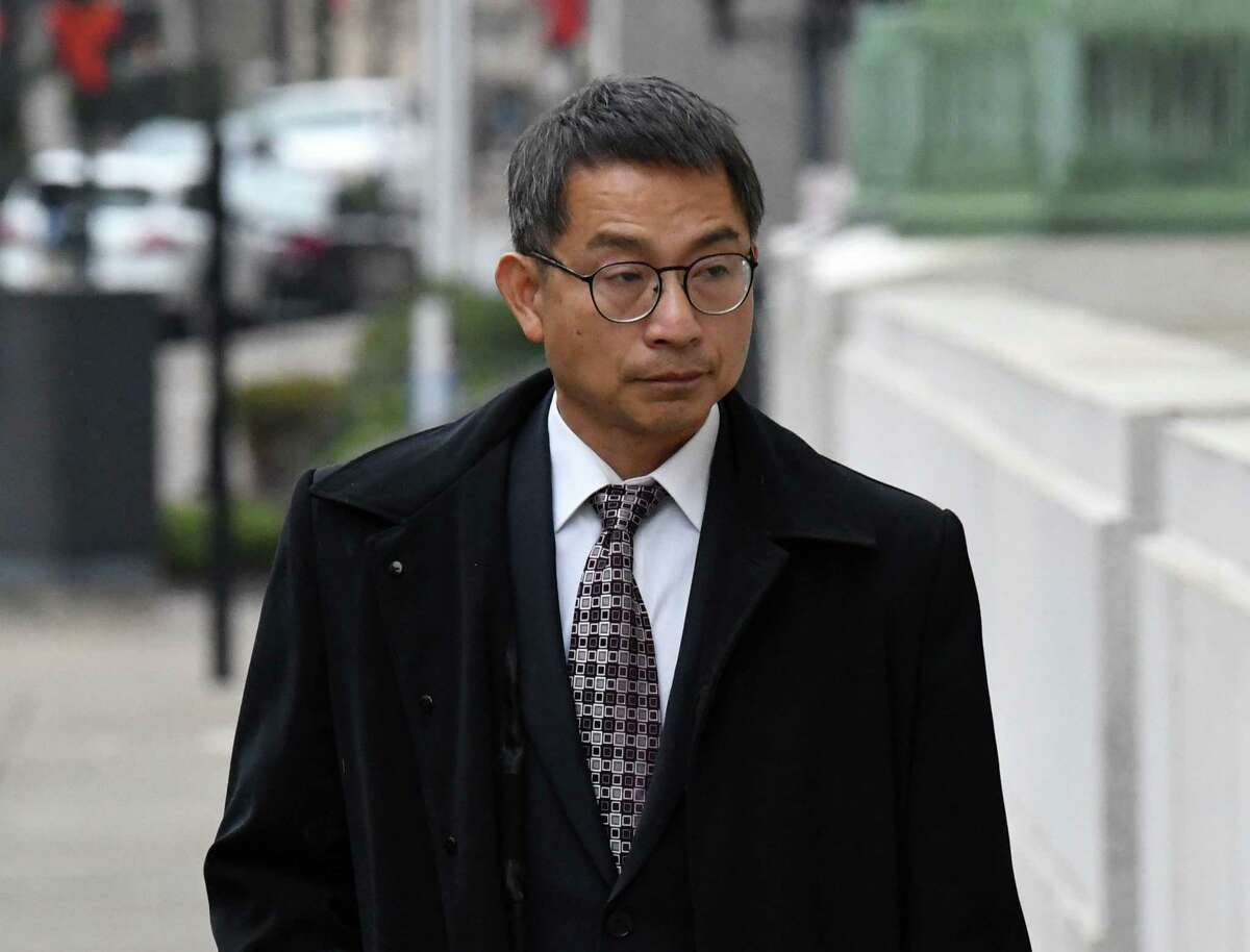 Xiaoqing Zheng, a former engineer at General Electric in Schenectady, walks to James T. Foley Federal Courthouse where he was sentenced for conspiring to send information to benefit the Chinese government on Tuesday, Jan. 3, 2023, in Albany, N.Y.