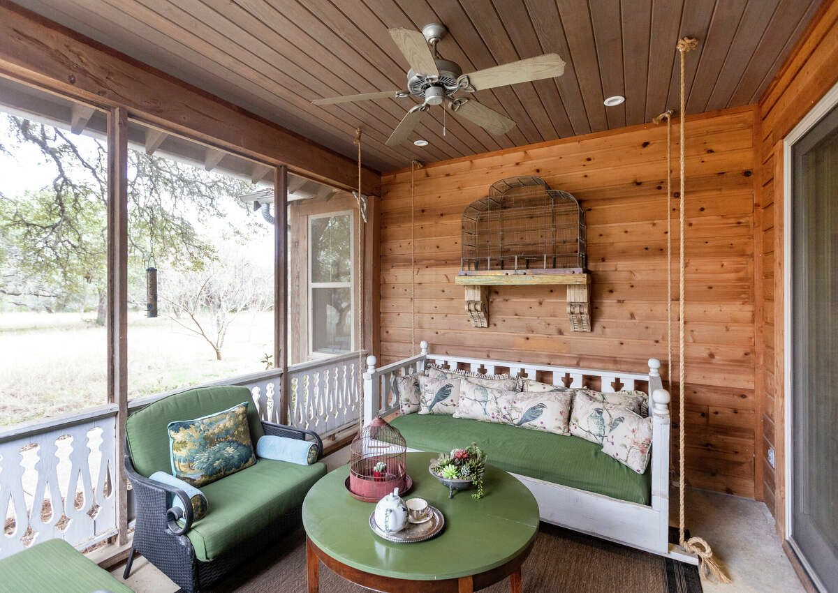 The couple enjoys bringing the outdoors inside their home, so they spent plenty of time in this screened-in porch.