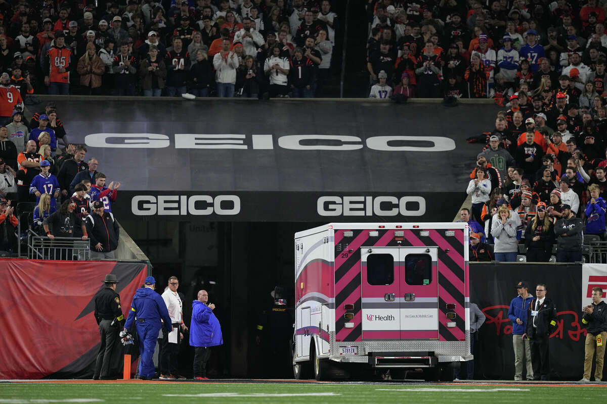CINCINNATI, OHIO - JANUARY 02: Fans look on as the ambulance leaves carrying Damar Hamlin #3 of the Buffalo Bills after he collapsed after making a tackle against the Cincinnati Bengals during the first quarter at Paycor Stadium on January 02, 2023 in Cincinnati, Ohio. (Photo by Dylan Buell/Getty Images)