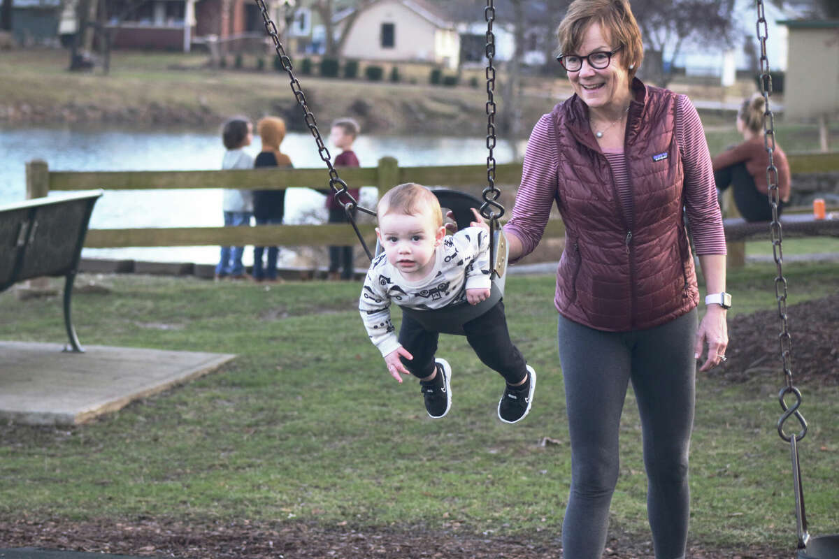 Wylie Wayman is pushed on the swing by grandmother Stacy Ragogna at LeClaire Park on Tuesday. The rest of the week won't be as pleasant for outside activities, as temperatures turn cold following the warm start to 2023.