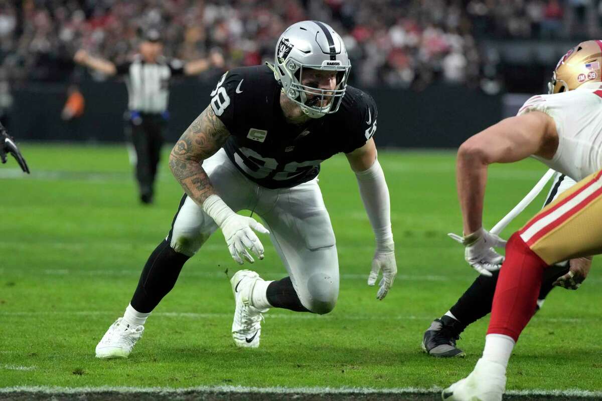 Las Vegas Raiders defensive end Maxx Crosby (98) celebrates after blocking  a field goal attempt …