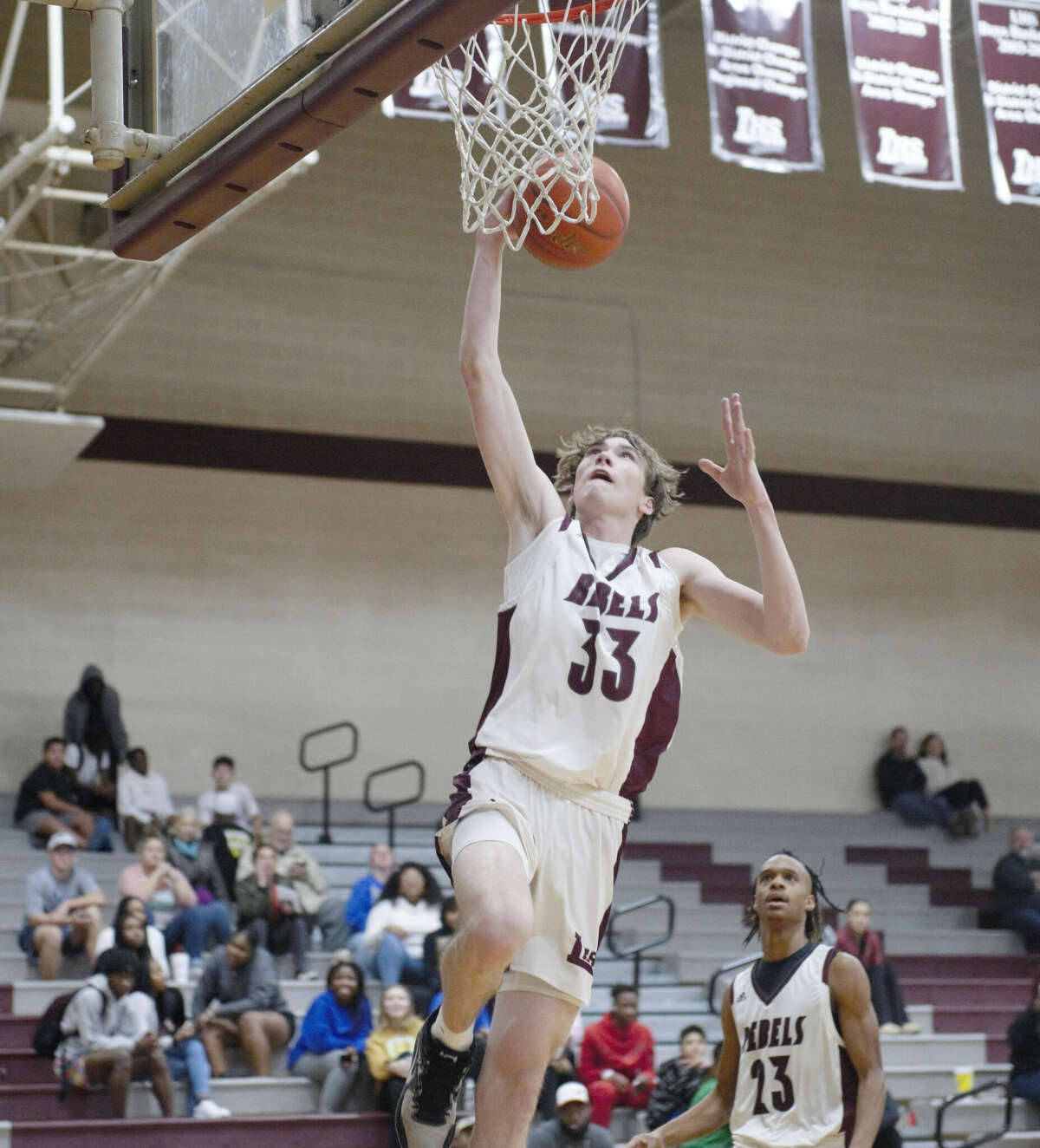 Legacy's Cutter Clark scores on a layup during a Jan. 3 basketball game against Pecos at Rebel Gymnasium. 